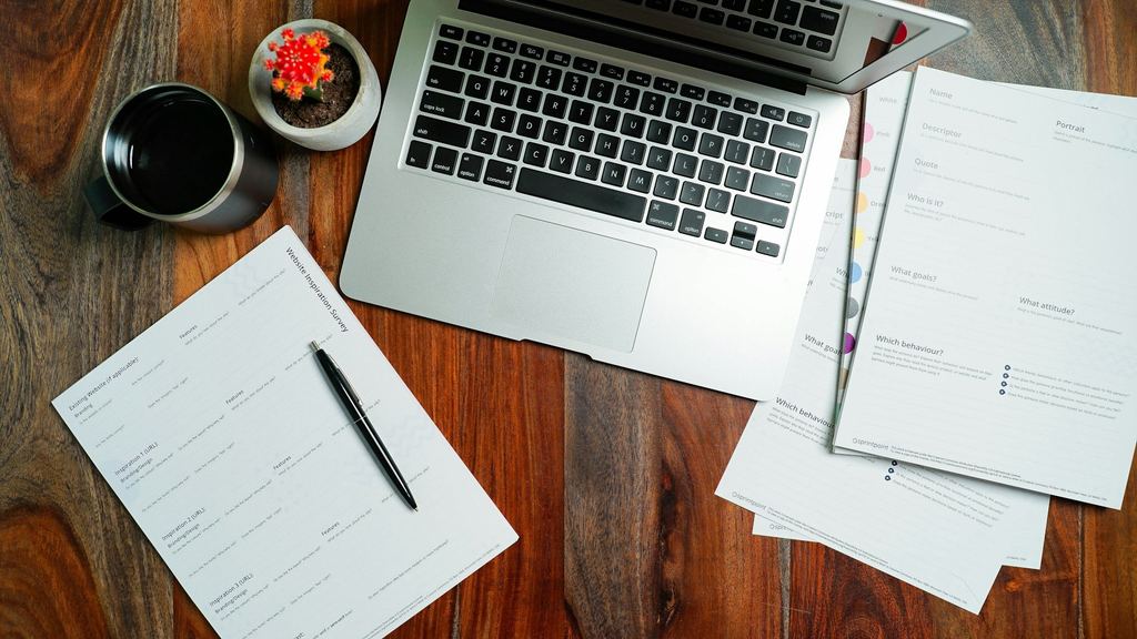 Business documentation on a desk, representing specification and paperwork review